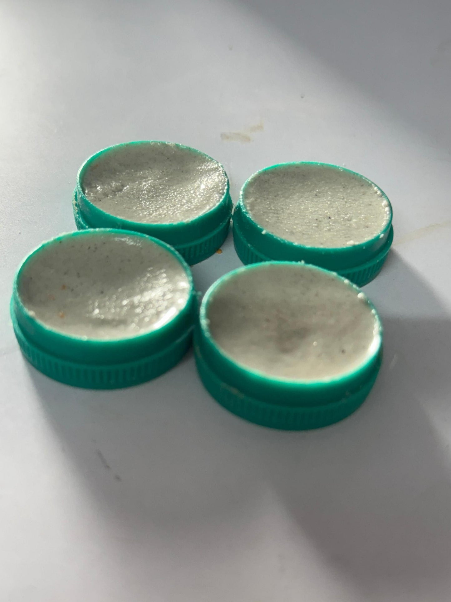 Four containers of cockroach killer gel for effective pest control in homes