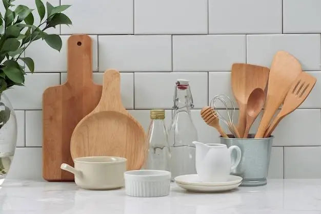 Stylish display of modern kitchen essentials including wooden tools, containers, and dishware