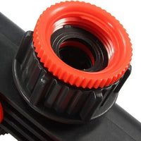 Close-up of a durable 4 way water tap connector with orange grip for easy handling and installation