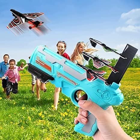 Colorful airplane launcher for kids with flying toy planes and children playing outdoors
