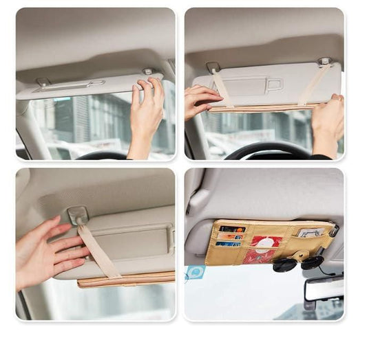 Hand installing a car visor organizer with multiple pockets for storing sunglasses and cards