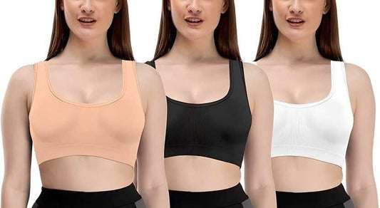 Set of three comfortable bras for women in black, white, and peach colors with a supportive design