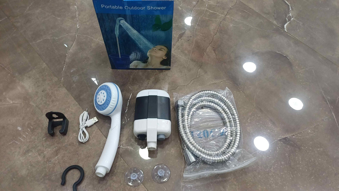 Compact outdoor shower system with handheld showerhead, hose, and installation accessories