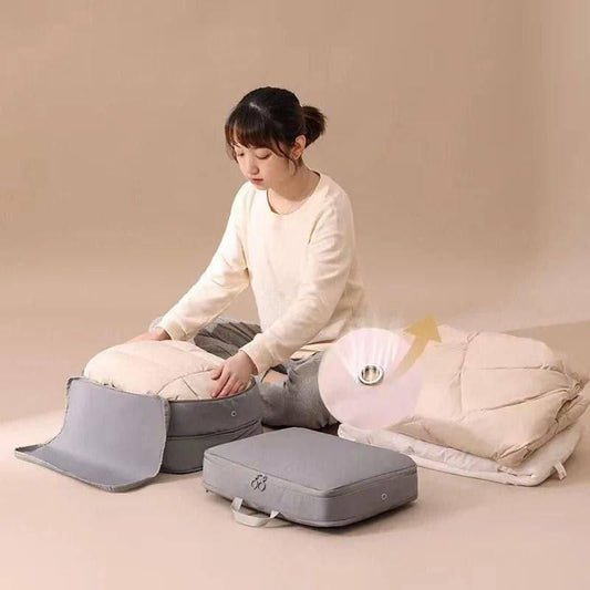 Woman using compression storage bags for travel to organize and save space for packing