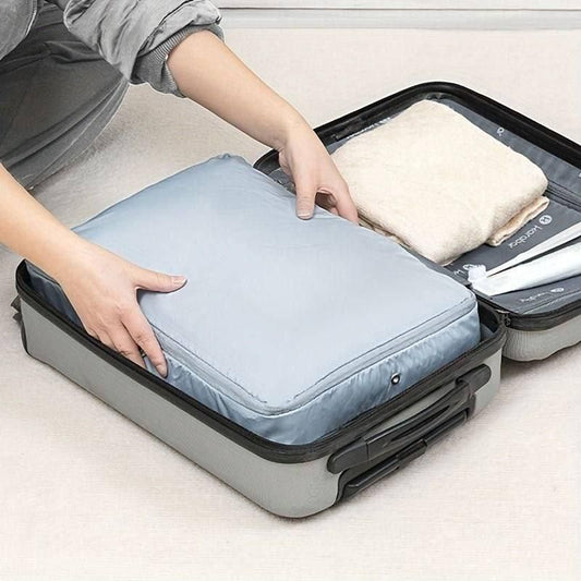 Compression storage bags for travel helping maximize suitcase space with neatly packed clothes