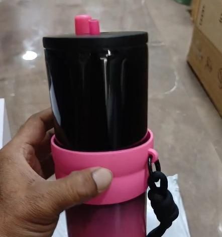 Black dual function tumbler with pink silicone grip and lid, perfect for on-the-go hydration