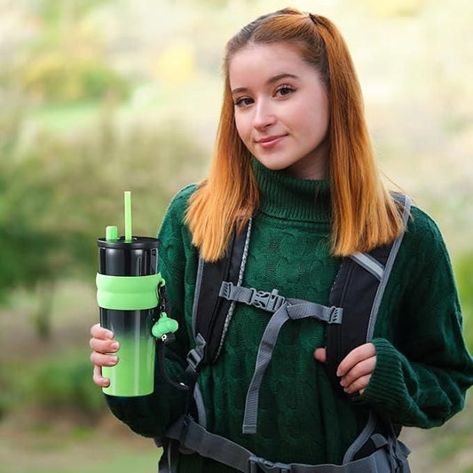 Girl holding a dual function tumbler with a straw, perfect for beverages and outdoor activities