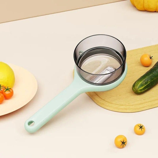 Multifunctional kitchen peeler with a green handle and a built-in container for easy food prep