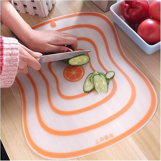Transparent flexible cutting board with orange pattern for easy food preparation and slicing